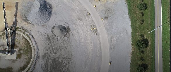 Aerial view of aggregate stockpiles and a processing structure