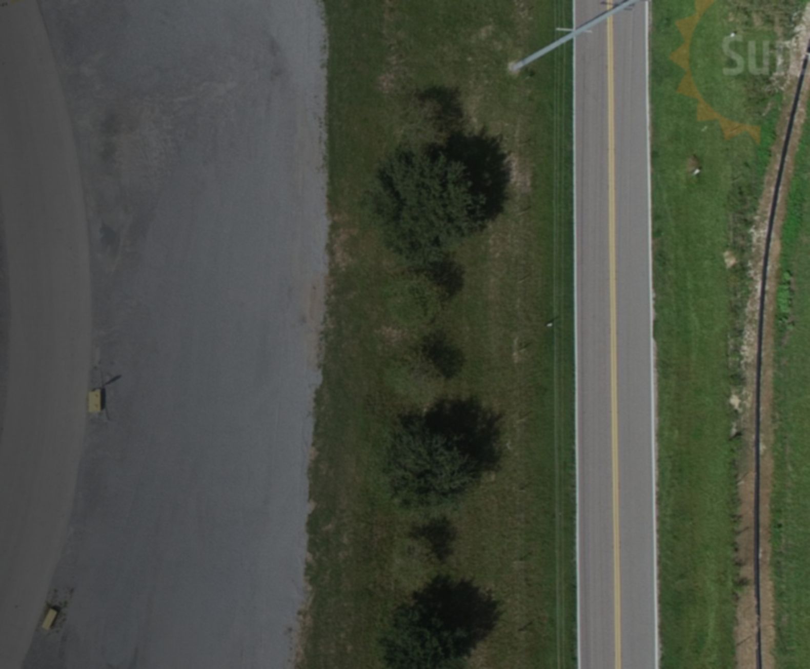Aerial view of an aggregate facility, haul road and rail siding