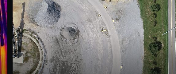 Aerial view of an aggregate yard with stockpiles and haul roads